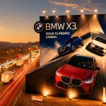 Panel publicitario de BMW X3 en la Panamericana Sur durante campaña verano 2026